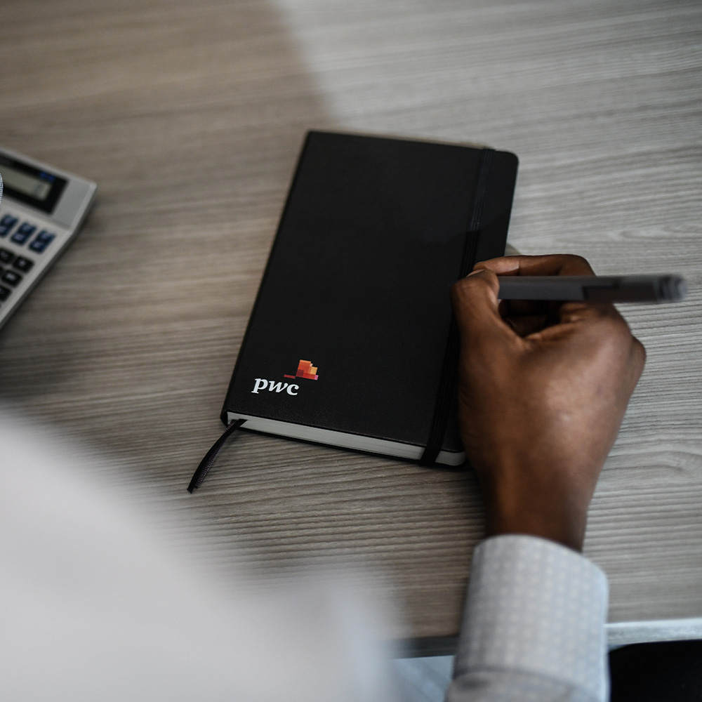 Notebook with company logo on it